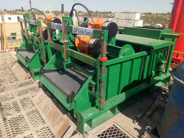 Multiple shale shakers installed on a drilling rig solids control system